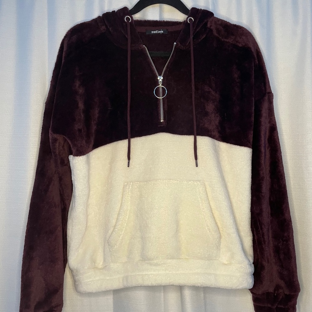 fuzzy maroon and cream hoodie.